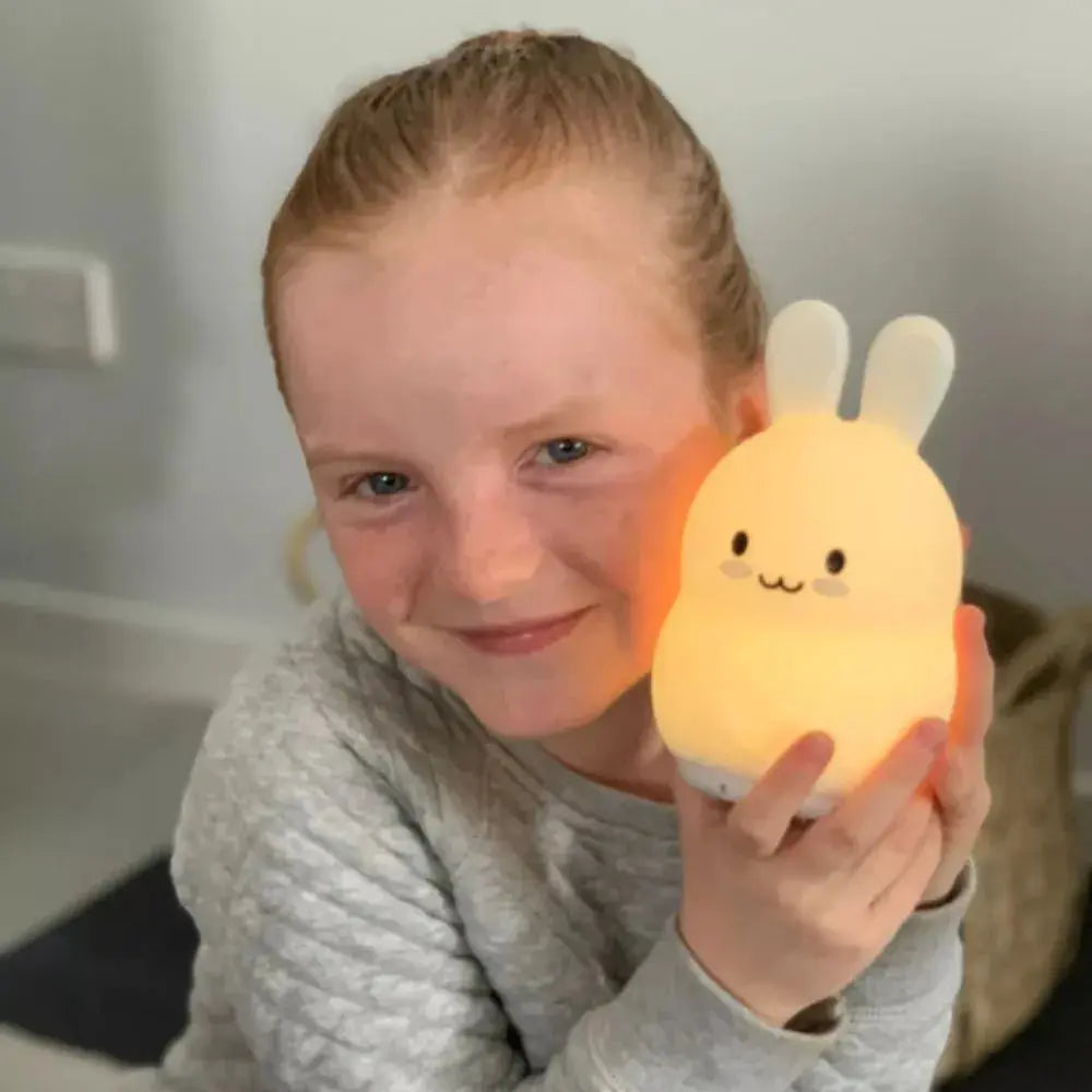 girl playing with her duski dream guardian bunny